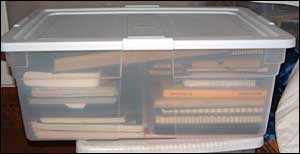 tupperware full of journals